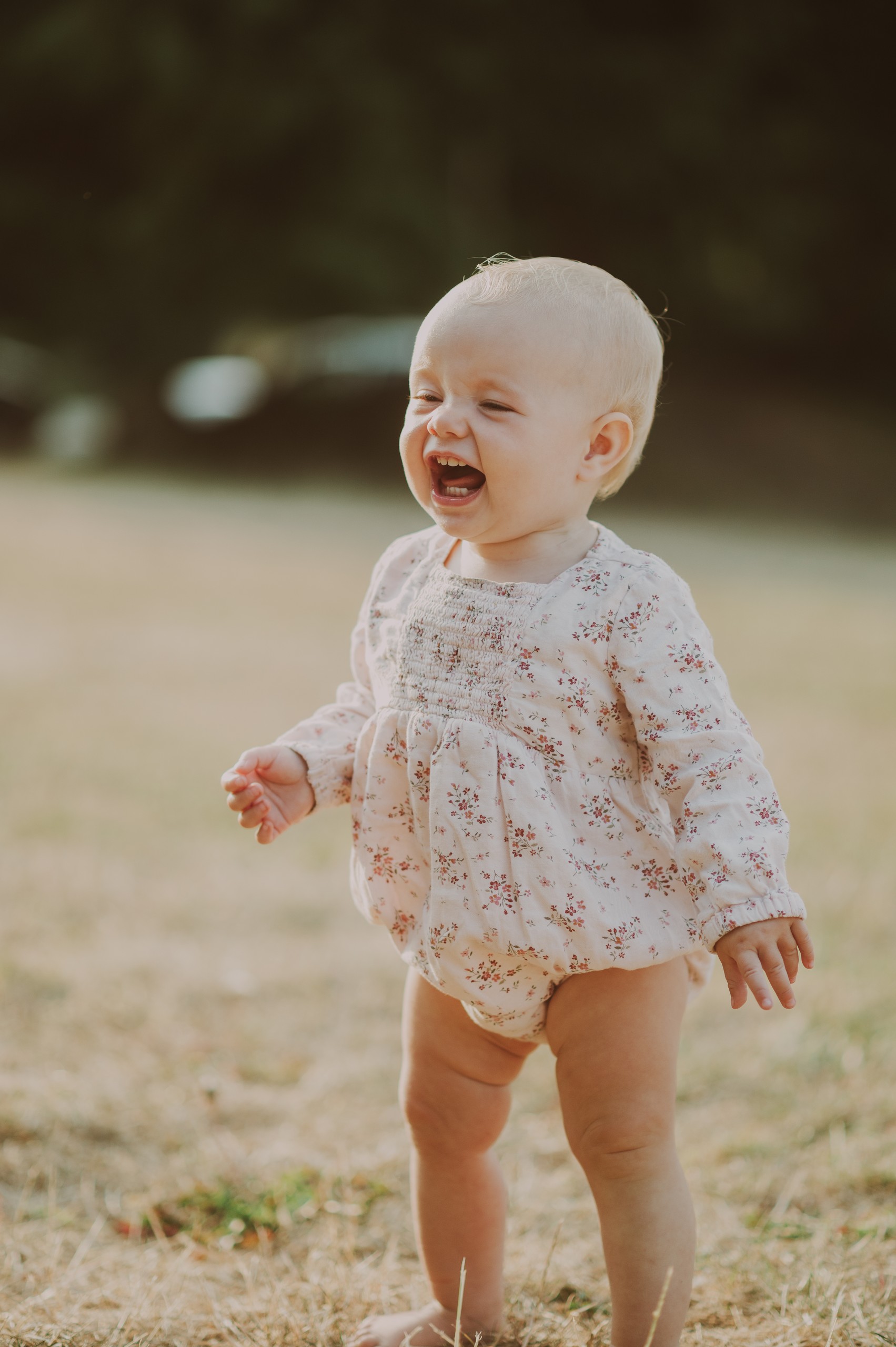 Baby laughing in the field